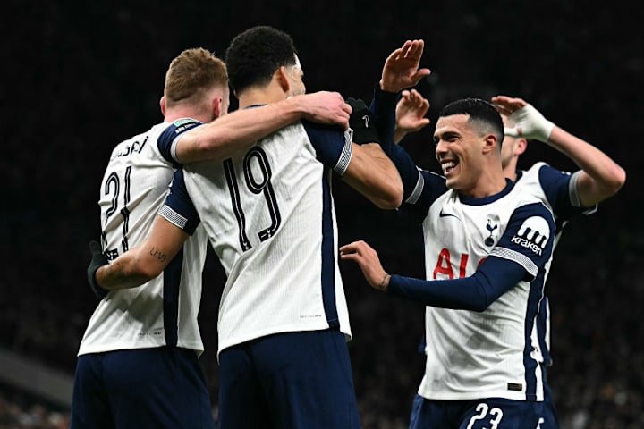 Tottenham's players celebrate scoring against Manchester Unite Tottenham's players celebrate scoring against Manchester Unite